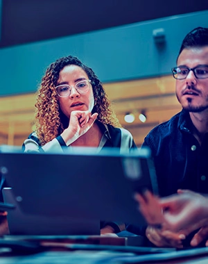 Two people using computer